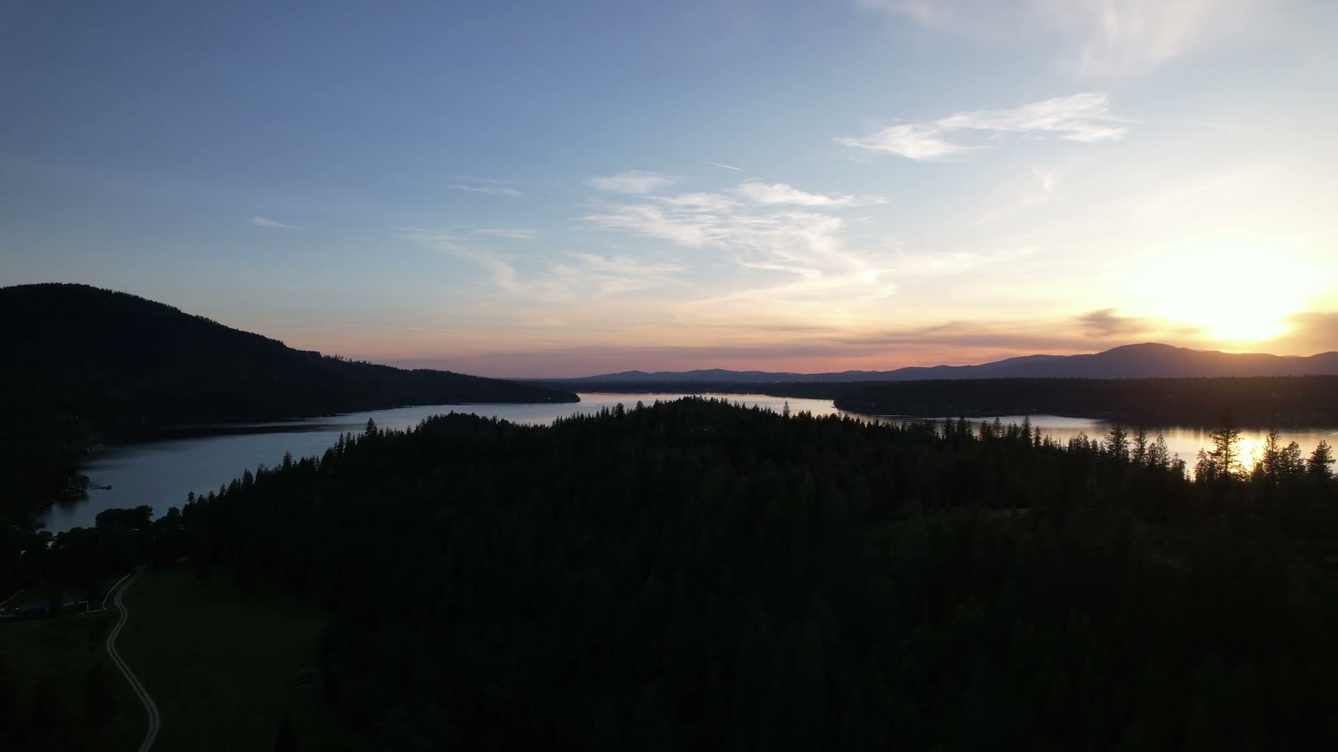 Lake and forest at sunset, filmed by Jeremy Kitchen